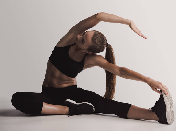 woman doing stretching exercises  - Fotografie, Obrázek