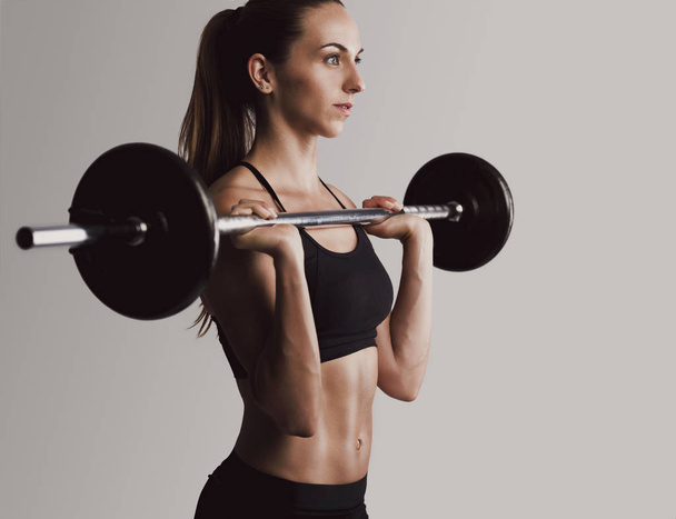 woman lifting weights - Фото, изображение