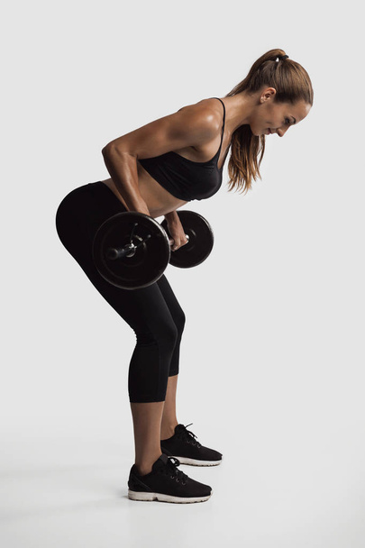 woman lifting weights - Fotoğraf, Görsel