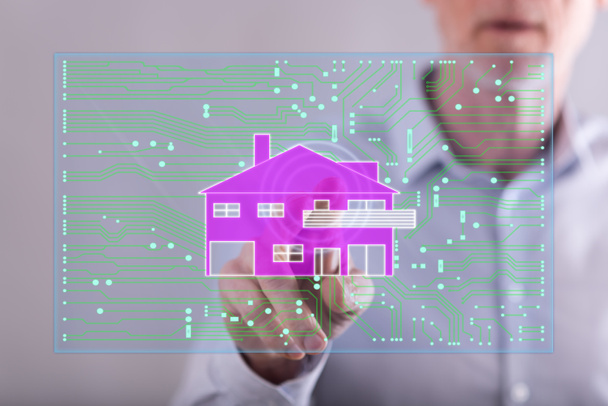 Man touching a digital smart home automation concept on a touch  - Photo, Image