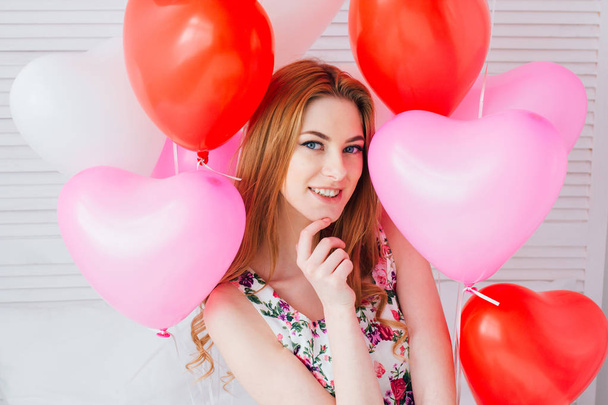 Girl in romantic dress with balloons in the shape of a heart - Φωτογραφία, εικόνα