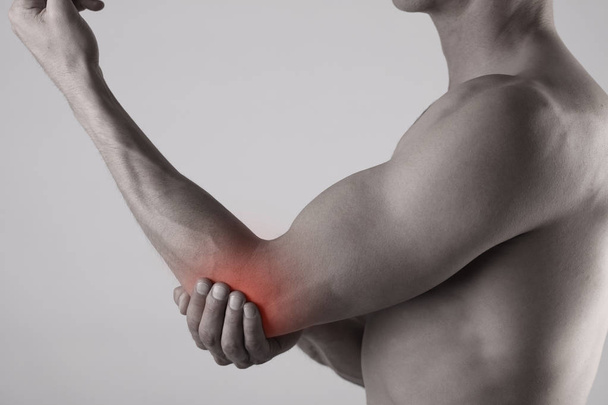 Man With Pain In Elbow. Pain relief concept - Фото, зображення