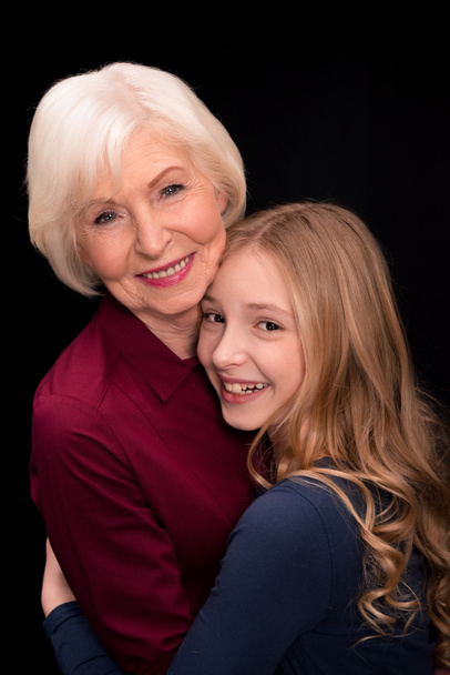 grandchild and grandmother hugging - Zdjęcie, obraz