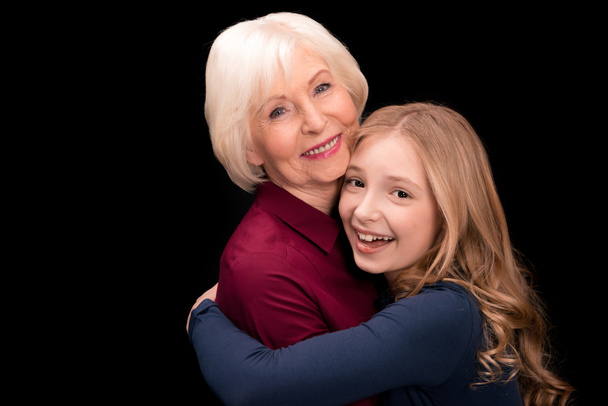grandchild and grandmother hugging - Valokuva, kuva