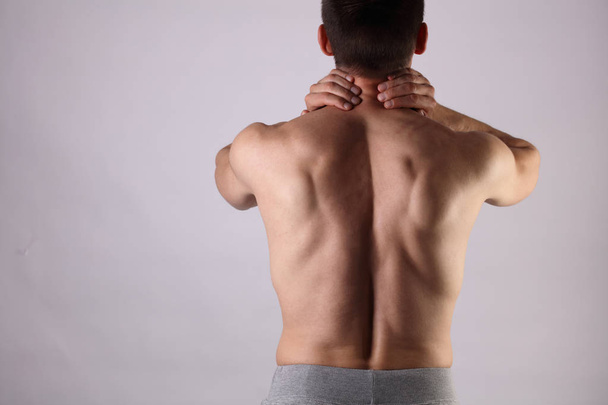 Sport injury, Man with back, neck pain. Pain relief and health care concept. - Fotoğraf, Görsel