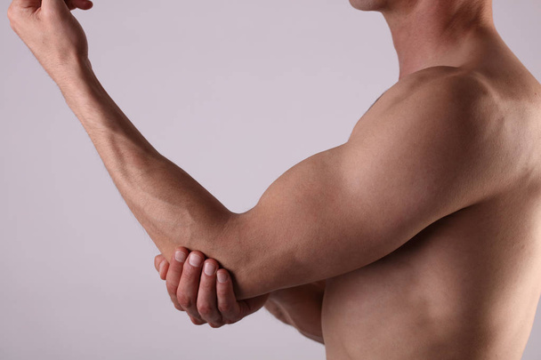 Man With Pain In Elbow. Pain relief concept - Valokuva, kuva