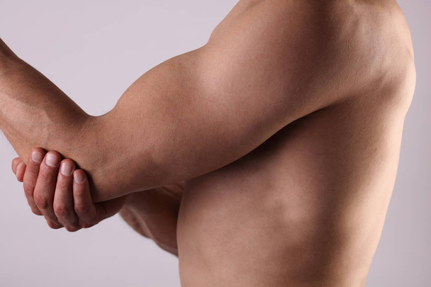Man With Pain In Elbow. Pain relief concept - Foto, Imagem