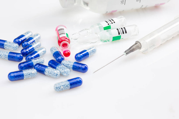 Blue capsules and pills background - Fotó, kép