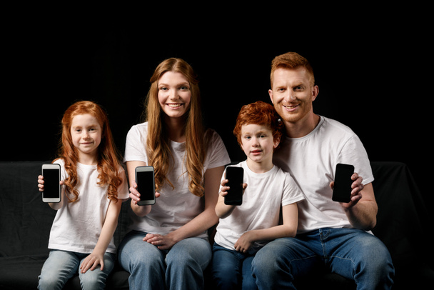 family showing smartphones - Photo, Image