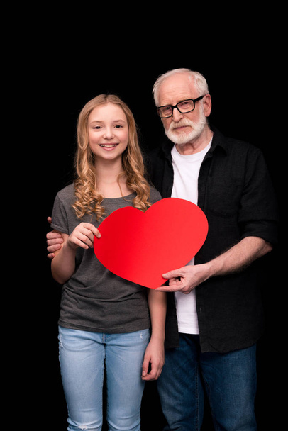 Grandfather and granddaughter with heart symbol  - Photo, Image