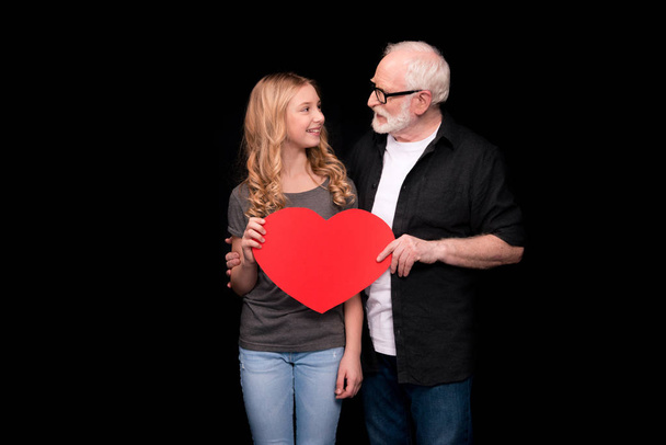 Grandfather and granddaughter with heart symbol  - Foto, Imagen