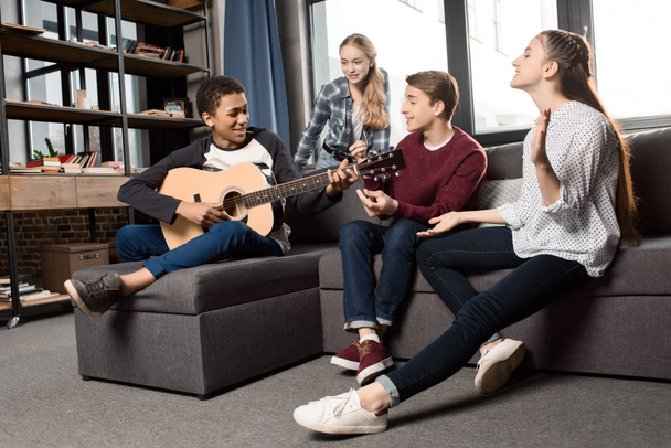 teenagers playing acustic guitar  - Photo, Image