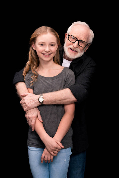 grandfather and teenage granddaughter - Фото, изображение