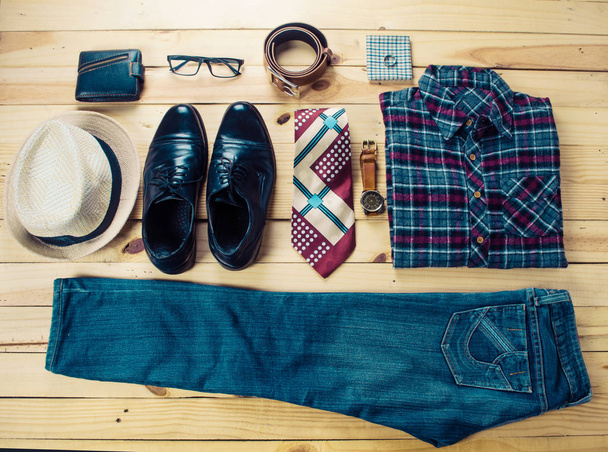 Clothing for mens on the wooden floor - 写真・画像