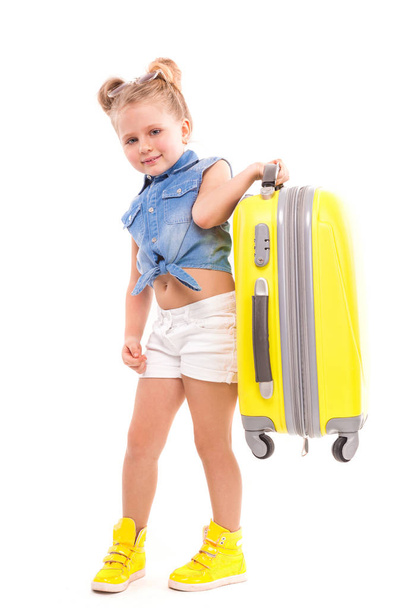 Little blonde girl with yellow suicase - Photo, Image
