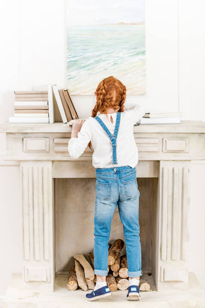 Little girl with books  - Zdjęcie, obraz