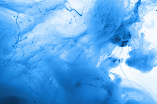 Acrylic colors and ink in water. Abstract background.  - 写真・画像