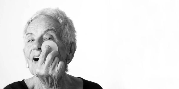 Senior woman make-up face on white background - Photo, image