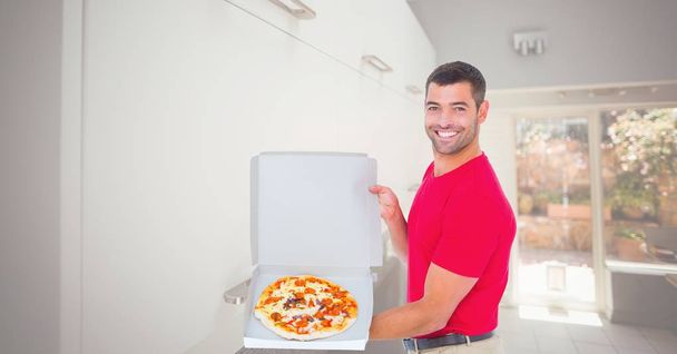man showing pizza in box - Photo, Image