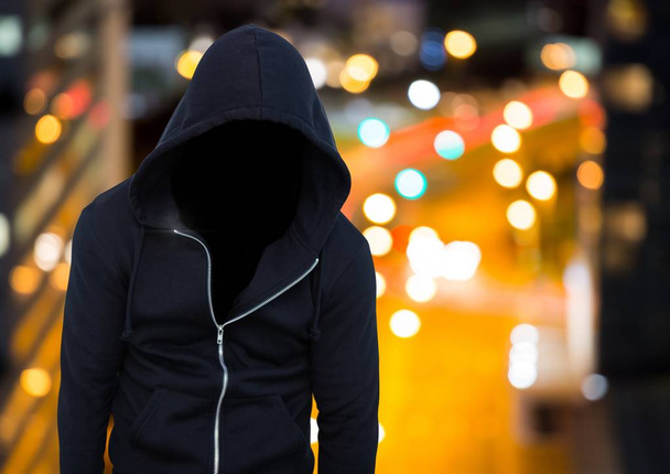 Anonymous man wearing hood  - Foto, afbeelding
