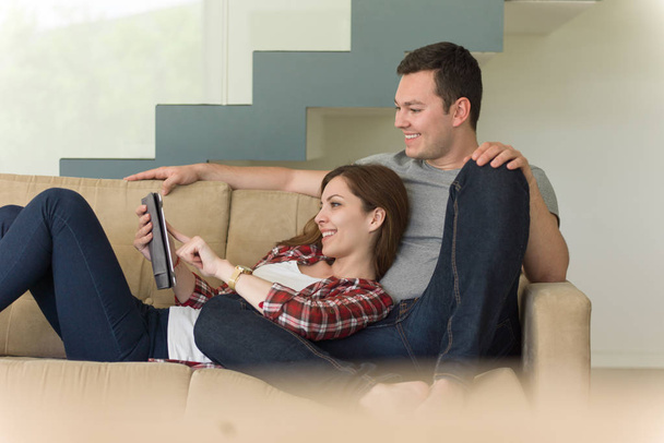 couple relaxing at  home with tablet computers - Photo, image