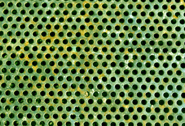 zielony kolor podłogi metalowe perforowane wzór.  - Zdjęcie, obraz