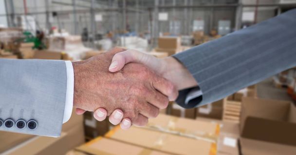 business people doing handshake in warehouse - Foto, imagen