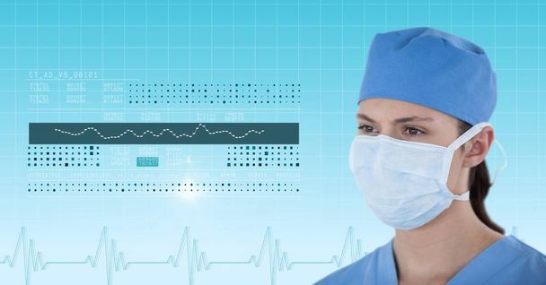 Женщина-хирург смотрит на медицинскую графику
 - Фото, изображение
