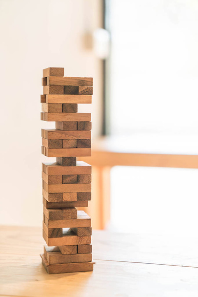 blocks wood game (jenga) on wooden table - Фото, зображення