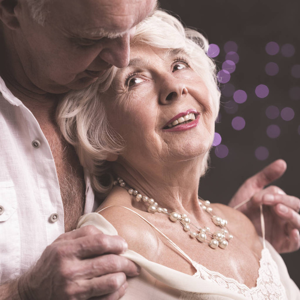 Senior lovers undressing each other  - Foto, Imagen