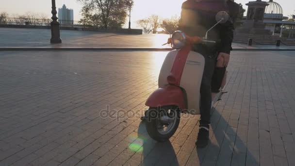 couple with moped in city at sunset - Footage, Video