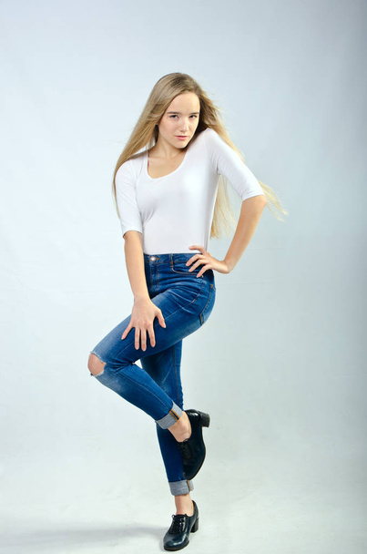 beautiful girl in t-shirt and jeans - 写真・画像