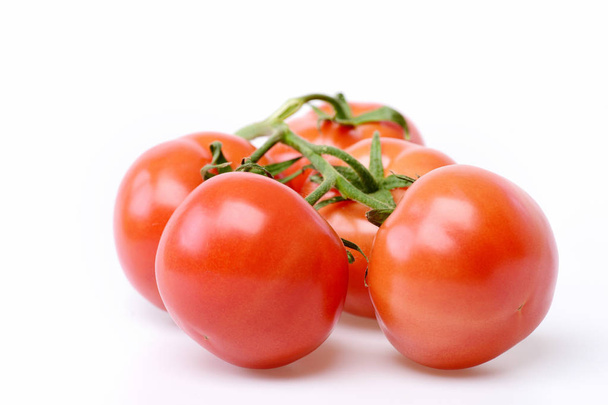 organic red tomatoes on vine - Fotografie, Obrázek