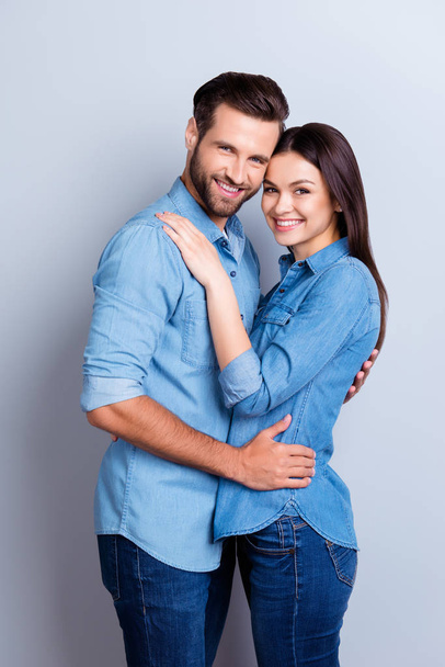 Vertical photo of two young cheerful people hugging each other a - Foto, imagen