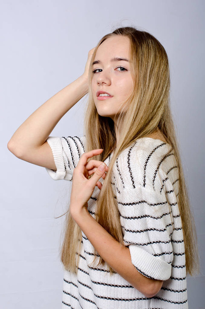 beautiful girl in striped sweater - Valokuva, kuva