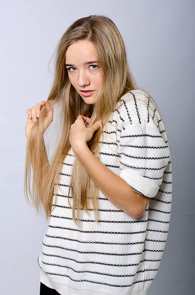 beautiful girl in striped sweater - Фото, изображение