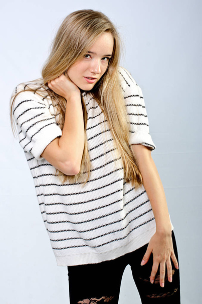 beautiful girl in striped sweater - Foto, Imagen
