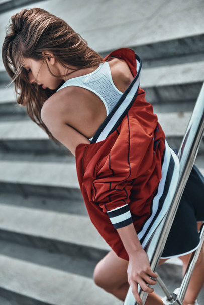 beautiful young woman in sport clothing - Фото, изображение