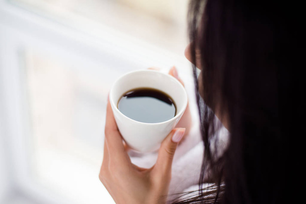 Coffee time! Close up cropped photo of woman drinking hot coffee - 写真・画像