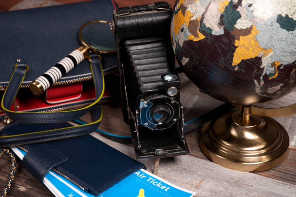  Air ticket, globe  and bag on wood background - Zdjęcie, obraz