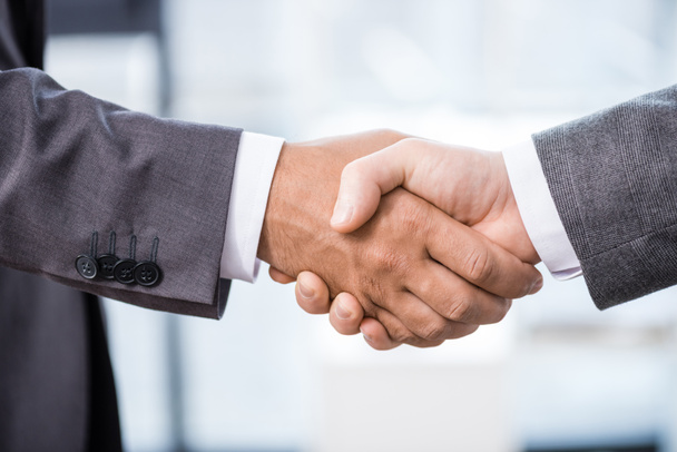 Businessmen shaking hands  - Foto, afbeelding