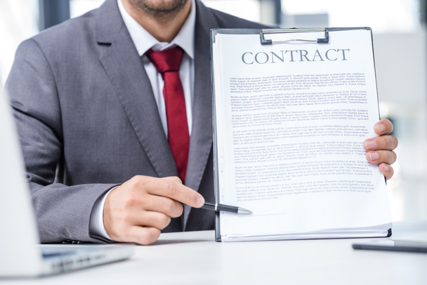 Businessman holding contract  - Photo, Image