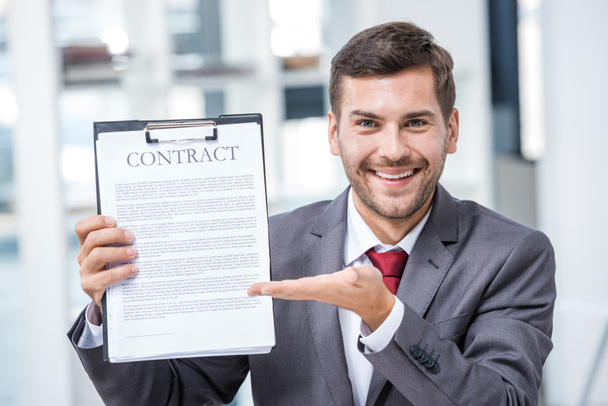 Businessman holding contract  - Fotó, kép