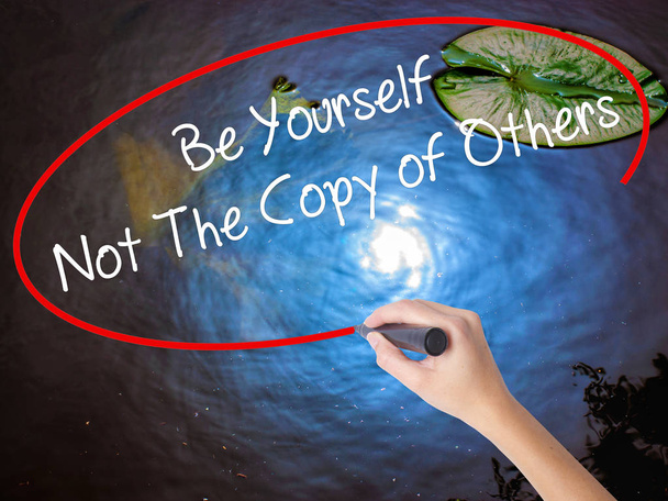 Woman Hand Writing Be Yourself Not The Copy of Others with marke - Photo, Image
