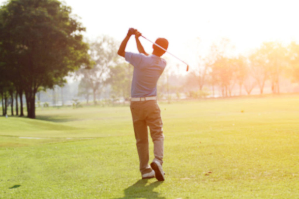 blurred golfers hit sweeping and keep golf course in the summer  - Zdjęcie, obraz