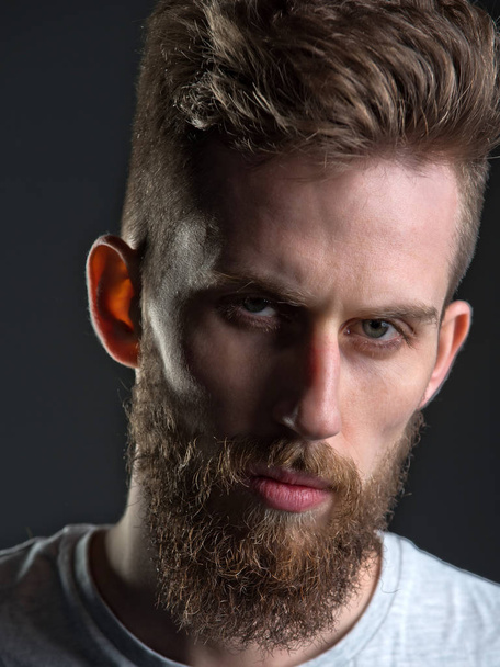 man, bearded young hipster has mustache on serious face - Foto, Imagen
