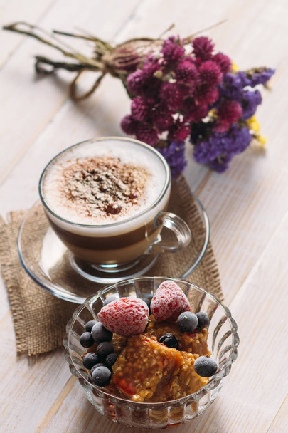 Sweet fruit dessert and cappuccino cup - Photo, image