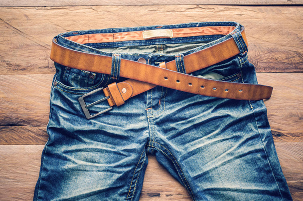 Jeans on a wooden floor - Foto, afbeelding