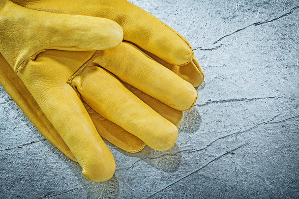 Leather protective gloves on metallic background construction co - Photo, Image