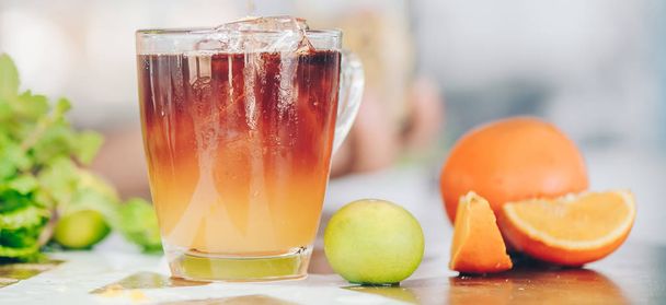 Refreshing lemonade with oranges and dry chrysanthemum on top - 写真・画像